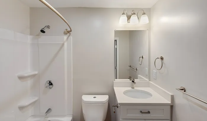 Modern bathroom with sleek design featuring a stylish vanity, pristine white shower, and elegant lighting.Your spacious kitchen offers generous square footage with room for multiple people and all your cooking essentials. | The Royal Crest | Apartment in,North Andover MA