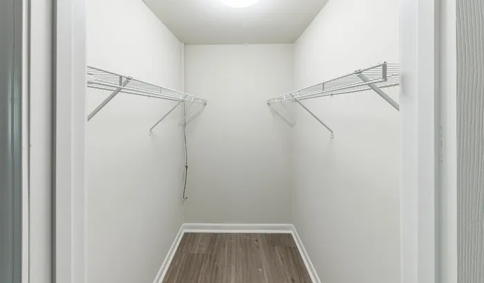 Spacious walk-in closet with built-in shelves, perfect for organizing and maximizing storage.Your spacious kitchen offers generous square footage with room for multiple people and all your cooking essentials. | The Royal Crest | Apartment in,North Andover MA