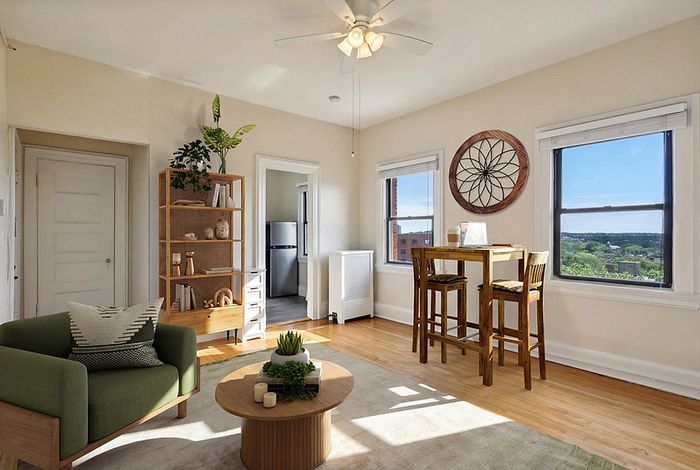 The pleasant living room creates a warm and comfortable atmosphere perfect for daily relaxation. | Princeton on Beacon Street | Apartment in Brookline, MA