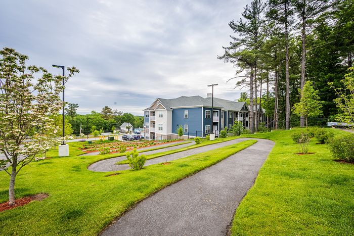 Stroll through our beautifully landscaped grounds featuring walking paths and tranquil outdoor spaces. | Mill & 3 Apartments | Chelmsford Apartments
