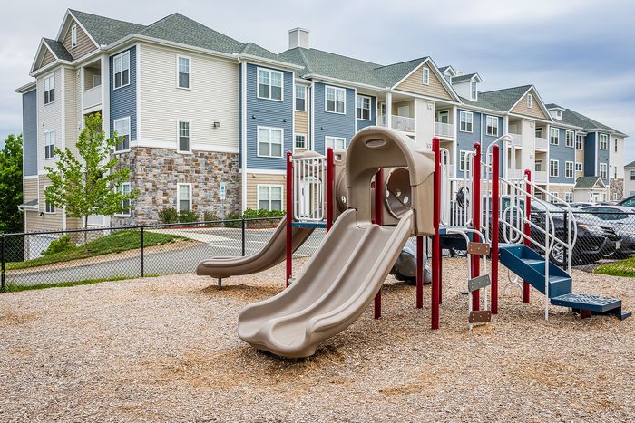 See how everyone enjoys our engaging playground designed for safe and active play. Just one more way our community caters to your needs! | Mill & 3 Apartments | Mill & 3 Apartments Apartments