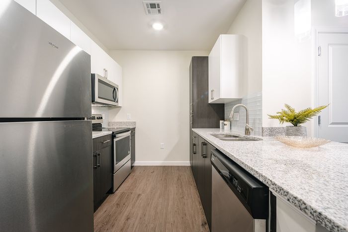 The modern kitchen offers streamlined design with efficient workflow and attractive finishes throughout. | Mill & 3 Apartments | Mill & 3 Apartments Apartments