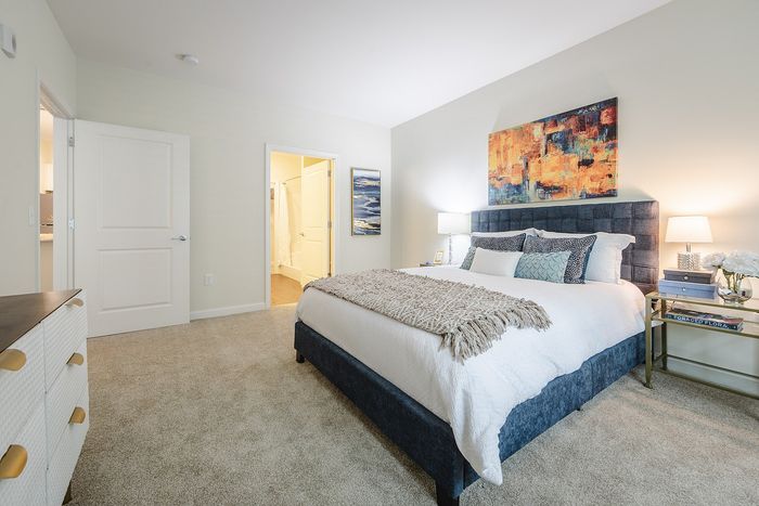 Your primary bedroom suite provides luxurious privacy with ensuite bathroom and walk-in closet convenience. | Mill & 3 Apartments | Chelmsford Apartments