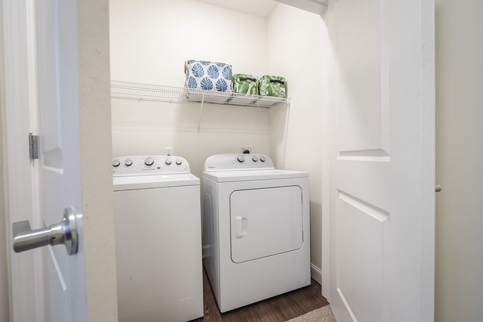 Handle laundry day with ease in our convenient on-site facility featuring efficient washers and dryers. | Mill & 3 Apartments |