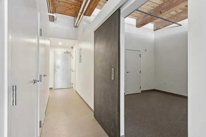 Your primary bedroom suite provides luxurious privacy with ensuite bathroom and walk-in closet convenience. | 381 Congress Lofts | Boston Apartments