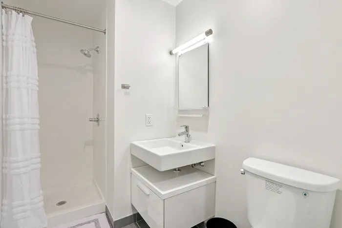 Your primary bedroom suite provides luxurious privacy with ensuite bathroom and walk-in closet convenience. | 381 Congress Lofts | Boston Apartments
