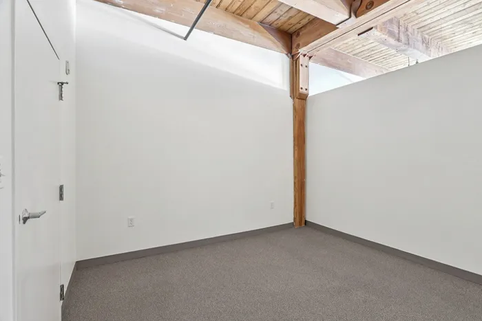Your spacious primary bedroom offers comfortable proportions with space for all your furniture and personal items. | 381 Congress Lofts |