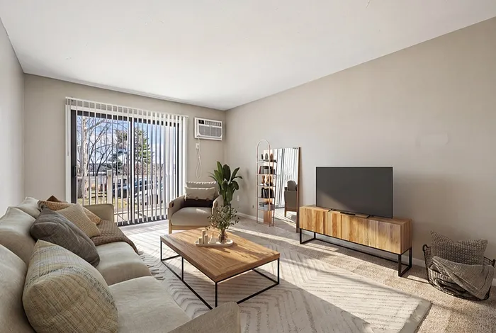Inviting living room filled with natural light, featuring modern decor, a cozy sofa, and a sleek TV unit for stylish relaxation.