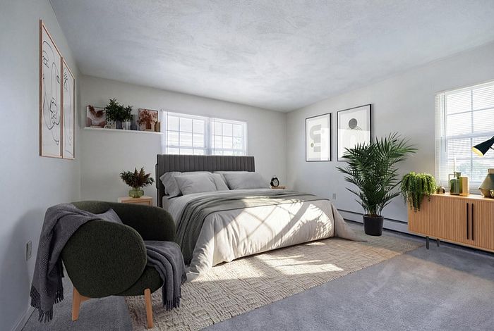 Bright and modern bedroom featuring elegant decor, plush bedding, and abundant natural light, perfect for relaxation.