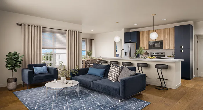 Princeton Wilmington Apartments | Modern open-concept living area with plush sofa, sleek kitchen island with bar stools, and vibrant dining space, featuring elegant decor and ample natural light. | Apartments for Rent in near boston