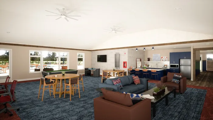 Modern communal area with cozy seating, stylish bar, and pool table in a spacious open-plan design, bathed in natural light from large windows.