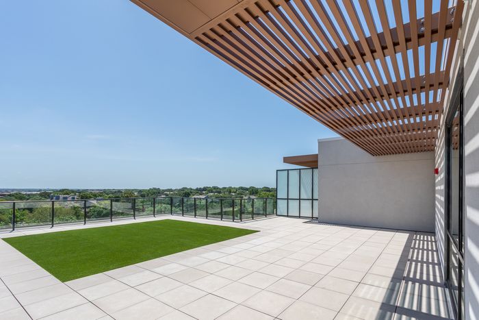 Spacious Penthouse Patio With Turf