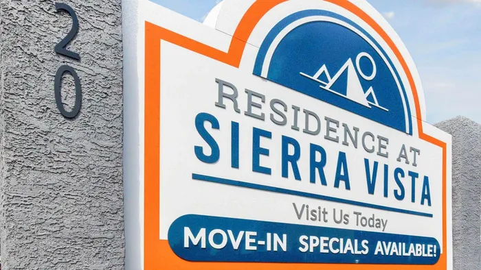 Entrance sign for Residence at Sierra Vista highlighting move-in specials.