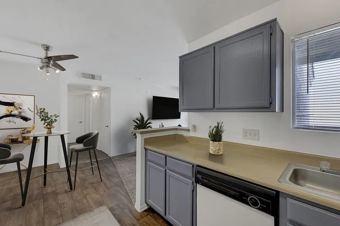 Modern kitchen and dining area with stylish cabinetry and elegant decor.