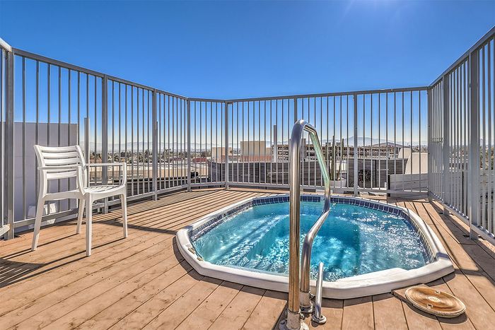 Exclusive rooftop oasis featuring a private plunge pool, panoramic city views, and sunlit deck space.