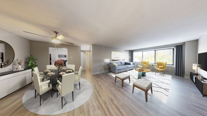Furnished open concept home with wood plank-style flooring