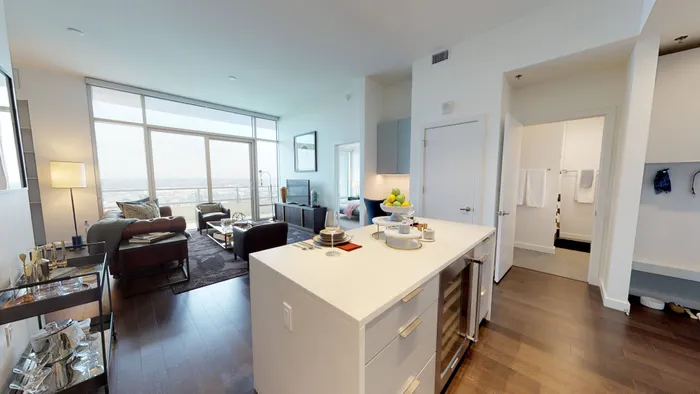 Kitchen island featuring storage and built in wine cooler
