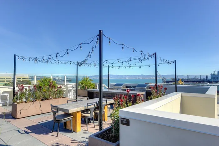 Rooftop grilling and outdoor dining area
