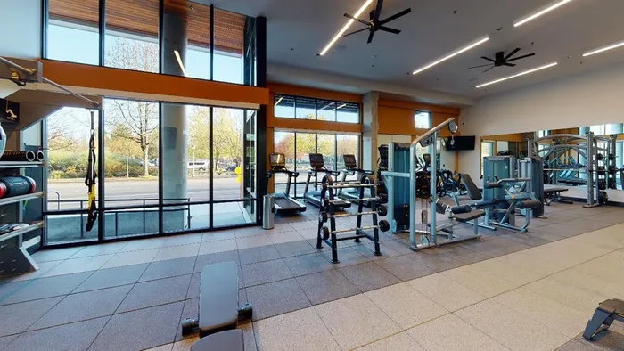 Fully-equipped fitness center   at Modera River Trail apartments.
