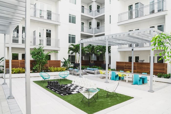 Outdoor Game Area with Giant Chessboard at Modera Creative Village | Apartments in Orlando, Florida