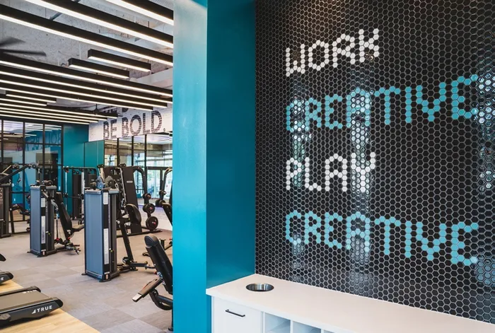 Motivational Sign & Exercise Equipment in Resident Fitness Center | Modera Creative Village | Apartments in Orlando, Florida