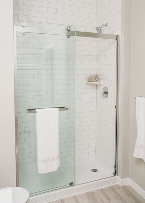 Walk-in shower with glass doors in Bathroom | Modera Creative Village | Orlando Apartments