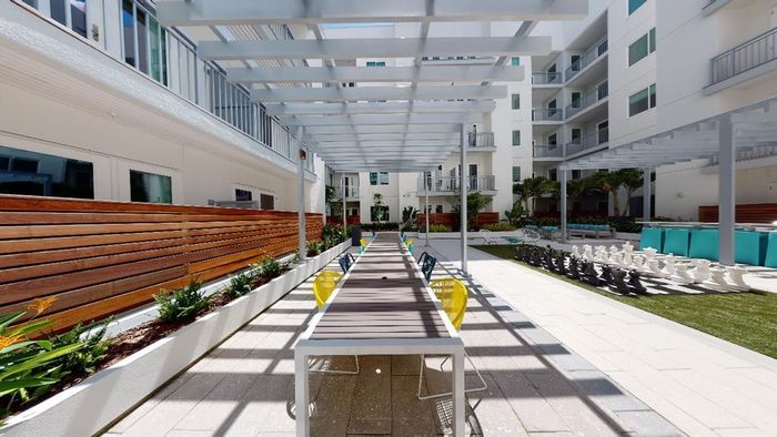 Make Dinner on the BBQ Grills, Play Outdoor Games, or Lounge in our Outdoor Active Courtyard at Modera Creative Village apartments