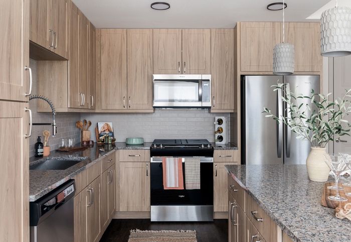 Custom 42” Cabinetry in kitchen  at Modera Six Pines Apartments.