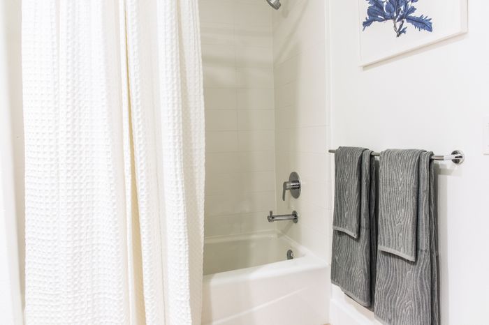 high-end bathroom with bathtub and new fixtures  at the Arroyo Residences in Walnut Creek