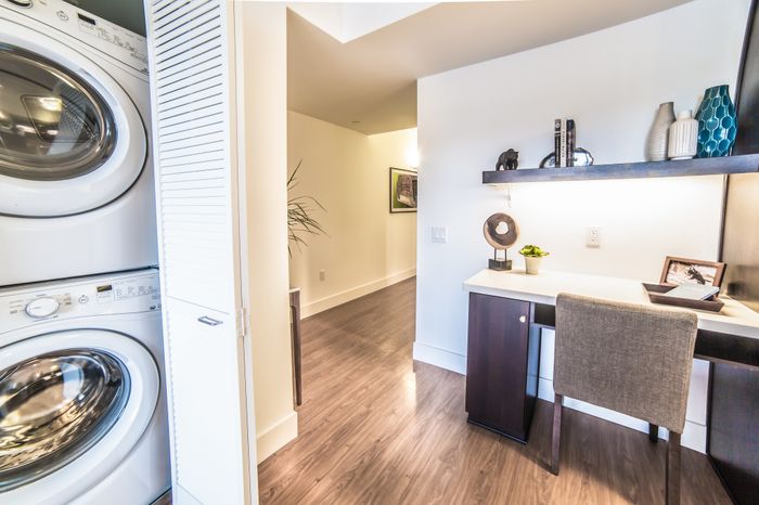 Desk area and in-home washer and dryer at the Arroyo Residences in Walnut Creek