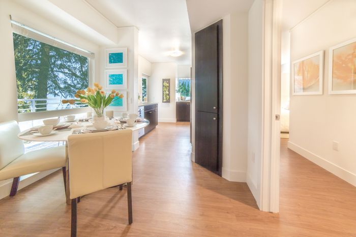 Spacious living and dining area leading to kitchen at the Arroyo Residences in Walnut Creek