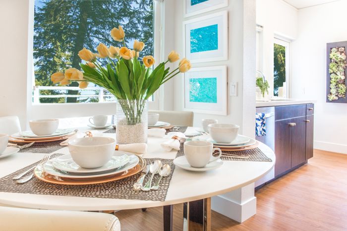Living room area with dining table Opat the Arroyo Residences in Walnut Creek
