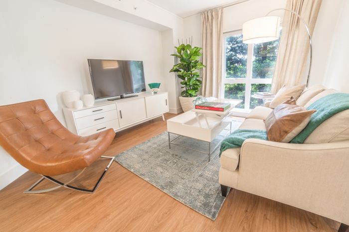 Living room area with large windows at the Arroyo Residences in Walnut Creek