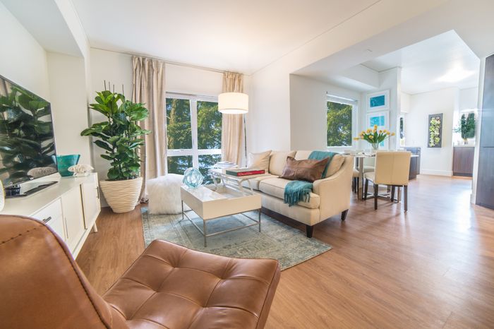 Spacious living and dining area leading to kitchen at the Arroyo Residences in Walnut Creek