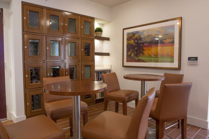 resident lounge with bar-style seating and storage lockers at the arroyo residences in walnut creek