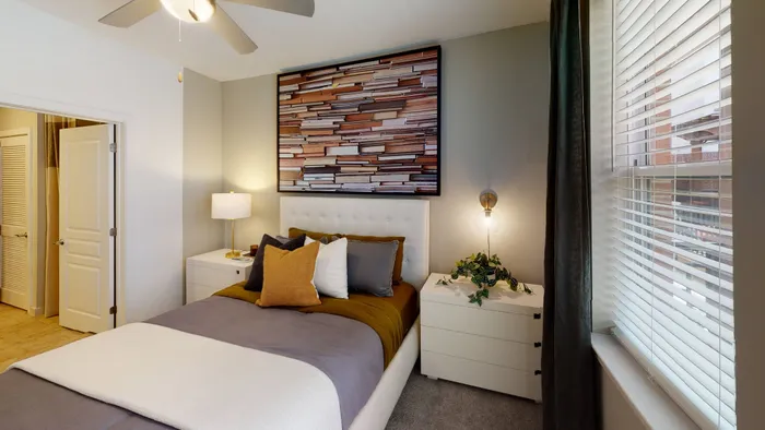 Image of bedroom with window and ceiling fan