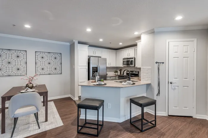 Kitchen with island seating and high-end appliances at Alister Galleria apartments houston texas