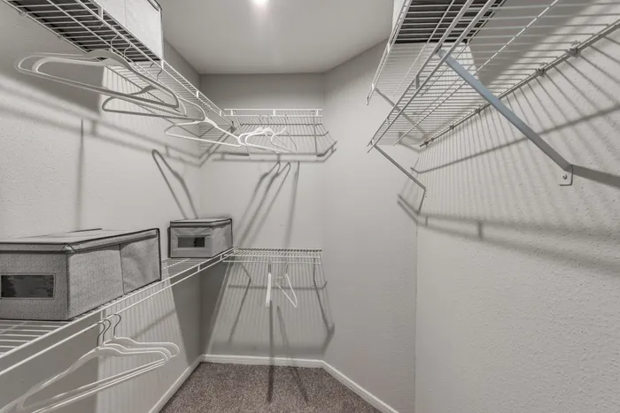 Large closet with shelving at Alister Galleria apartments houston texas