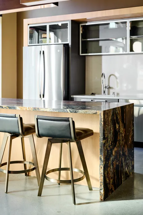 bar seating and kitchen island at Modera Berkeley apartments California