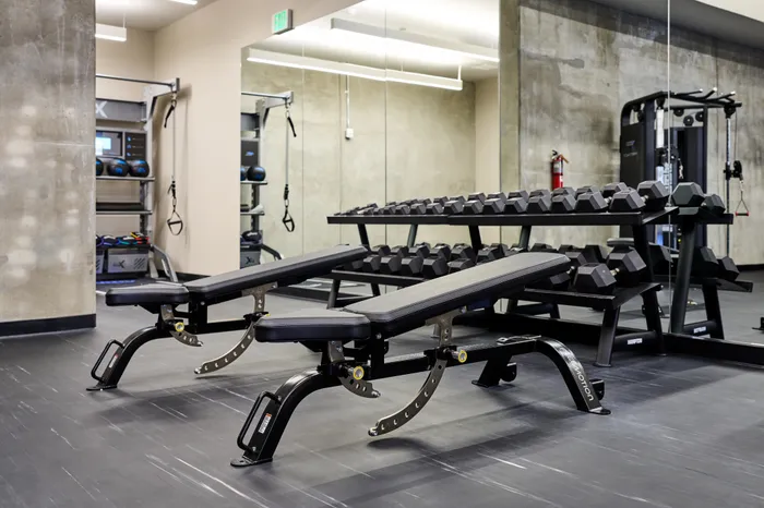 large fitness center with high-end equipment at Modera Berkeley apartments California