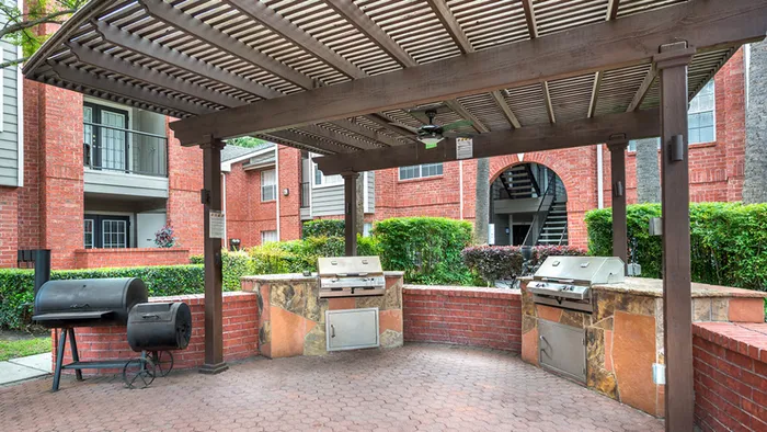 Outdoor grilling under a shaded area at Alister Galleria.