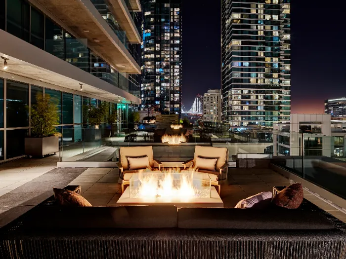 Enjoy a nighttime fire on our rooftop terrace at Modera Rincon Hill apartments.