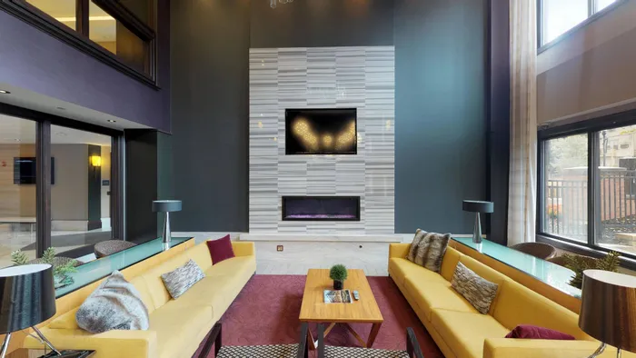 Resident lounge with ample seating and fireplace