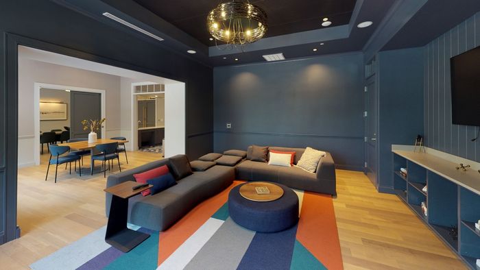Image of theater room and dining area at Modera Needham Apartments