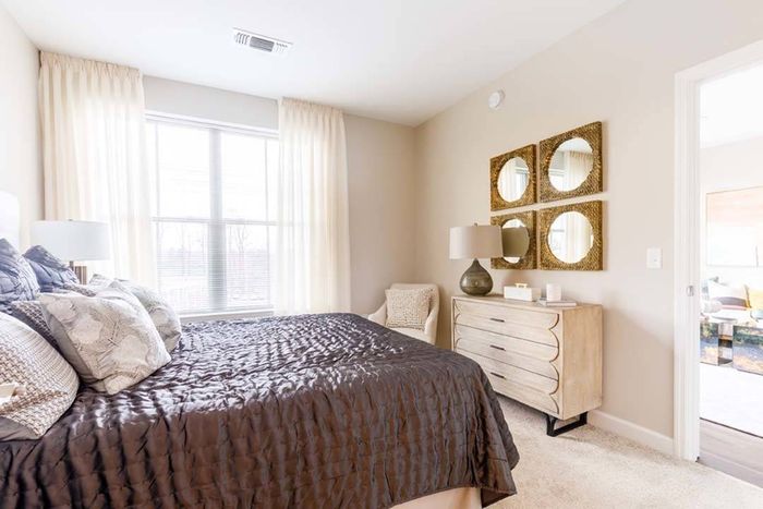 Spacious bathrooms with plush carpets and large windows