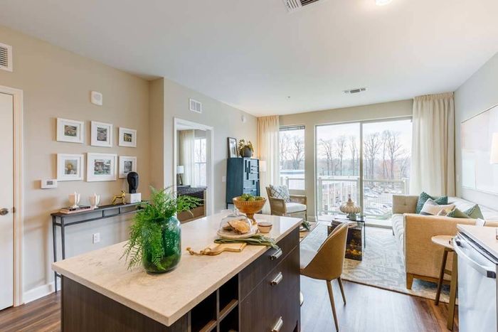 Kitchen island with large windows and balcony in the bathroom