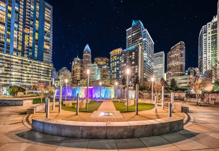 Downtown Charlotte skyline at night near Alister Uptown apartments.