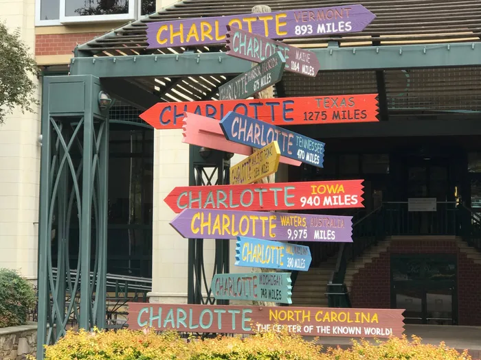 Directional signs featuring Charlotte.