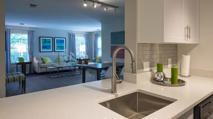 Open Concept Kitchen with Subway Tile Back Splash and White Cabinetry