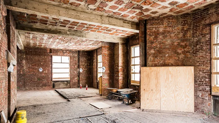 Interior room with exposed brick during renovation